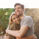 An image of a young couple embracing.