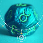 zodiac dice over blue background with Taurus symbol.