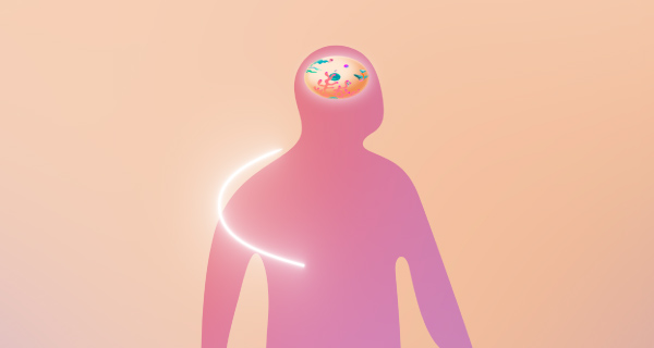 A dream analysis blog header showing a pink-colored outline of someone with colorful confetti rolling around in their head, over an orange background.