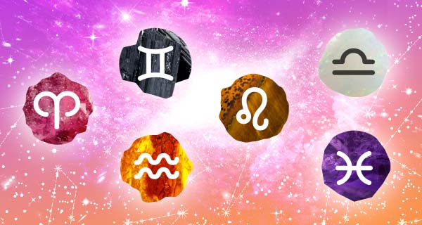 An image depicting crystals for different zodiac signs, with Aries over a red stone, Gemini over a black stone, Aquarius over an orange stone, Leo over a brown stone, Taurus over a gray stone, and Pisces over a purple stone.