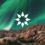 The California Psychics logo (a lotus flower that looks like the sun) over a mountain range. The sky is tinted with green light.