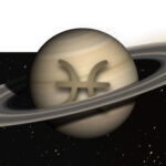 An image of the planet Saturn, with the symbol of Pisces in the center.