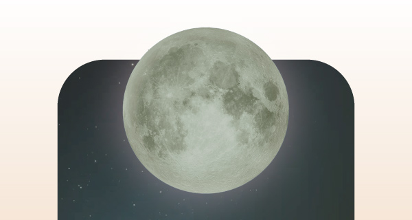 An image of the Full Buck Moon, tinted a light green.