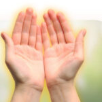 Two cupped hands, with just the faintest hint of an aura emanating from them.