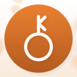 Chiron symbol over a light orange background
