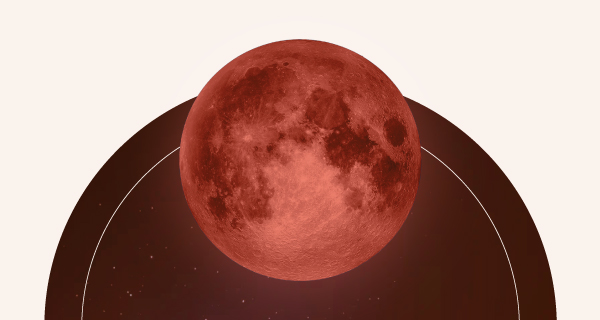 A red moon rising in the night sky