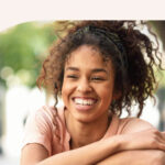 A woman smiling at the camera.