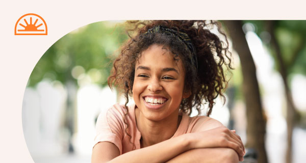 A woman smiling at the camera.