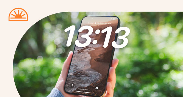 A phone with the time 13:13 on the home screen.