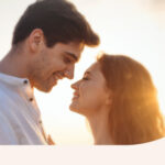 A couple standing together in the evening sun