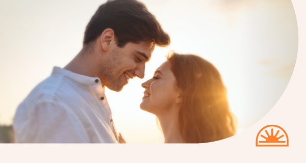 A couple standing together in the evening sun
