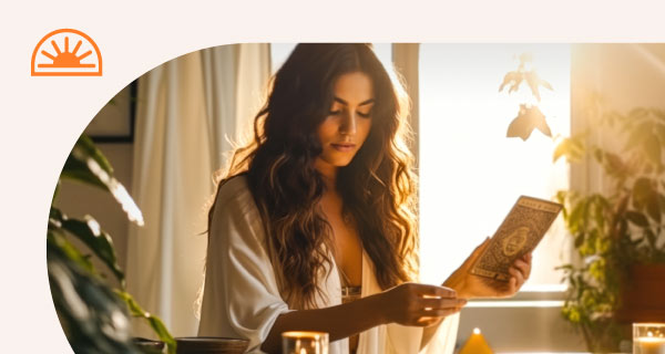 A woman sitting at her table with a laptop in front of her.