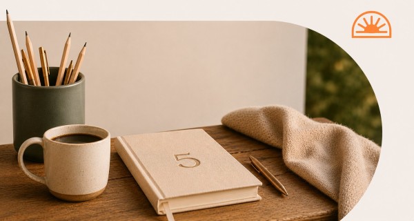A journal emblazoned with the number 5 on the table