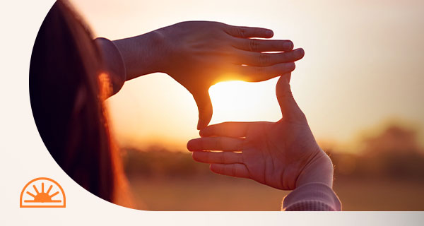 A woman looking at the sunset